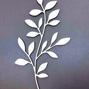 May include: White wooden cutout of a leafy branch with multiple leaves. The branch is curved and has a natural, organic look.