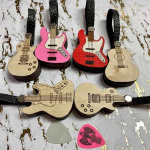 Laser cut wooden guitar pick holder with leather strap