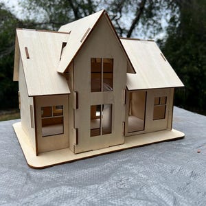 Rustic Miniature Dollhouse Kit with Slanted Roof, Multiple Windows, and Doors