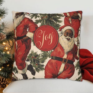 Brighten up your holiday decor with this wonderful African American Santa Claus 'Joy' throw pillow featuring happy Santas &  pine detail. Choose whether to have a pillow insert - our covers are printed upon order in the US with outdoor options.