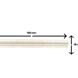 May include: A white ceramic tile trim piece measuring 400 mm in length and 45 mm in width.