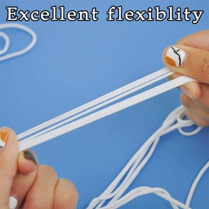 May include: White elastic cord being stretched and pulled by two hands. The cord is very flexible and can be stretched to a great length. The text "Excellent flexibility" is visible at the top of the image.