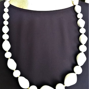 35&quot; white beaded necklace with gold accents