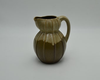 Colocynth pitcher in sandstone by Louis Lourioux