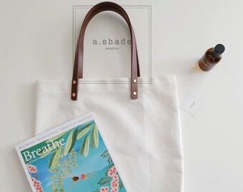 leather strap tote bag