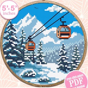 May include: Cross stitch pattern PDF for a 5x5 inch embroidery hoop featuring a snowy mountain scene with cable cars. The design includes a blue sky, white snow, and orange cable cars.