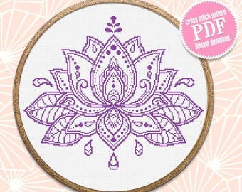 May include: Purple and white cross stitch pattern of a lotus flower in a wooden embroidery hoop. The pattern is available as a PDF instant download.