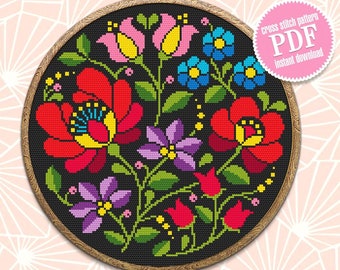 May include: A cross stitch pattern featuring a colorful floral design with red, yellow, pink, blue, purple, and green flowers on a black background. The pattern is framed in a wooden hoop. The text "cross stitch pattern PDF instant download" is on a pink circle.