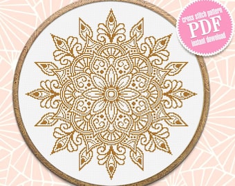 May include: A gold mandala cross stitch pattern in a wooden embroidery hoop. The pattern is intricate and detailed, with a floral design. The text "cross stitch pattern PDF instant download" is on a pink circle.