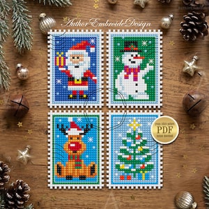 May include: Four rectangular cross-stitch patterns arranged in a grid, featuring a Santa Claus, a snowman, a reindeer, and a Christmas tree. Each design is framed by a white scalloped border resembling a postage stamp. Text reads Author EmbroideDesign.