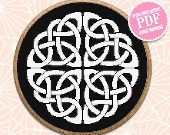 May include: A black and white cross stitch pattern of a Celtic knot design in a wooden embroidery hoop. The pattern is for a cross stitch project and is available as a PDF download.