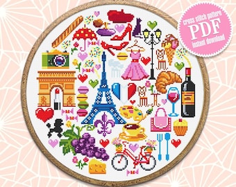 May include: A colorful cross stitch pattern featuring iconic Parisian symbols, including the Eiffel Tower, the Arc de Triomphe, a baguette, a beret, a bicycle, and a glass of wine. The pattern is framed in a wooden hoop and includes the text "cross stitch pattern PDF instant download".