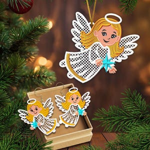May include: Christmas angel ornament and earrings set. The angel has blonde hair, a halo, and white wings. The angel is holding a blue star. The earrings are in a small box. The text "2 sizes" is visible.
