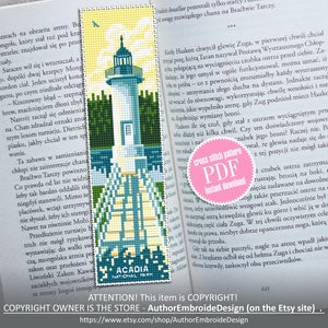 May include: A cross stitch pattern PDF for a lighthouse with a white tower and a blue roof. The lighthouse is on a small island with a path leading to it. The pattern is in a pink circle with the words "cross stitch pattern PDF instant download". The text "Acadia National Park" is at the bottom of the image.