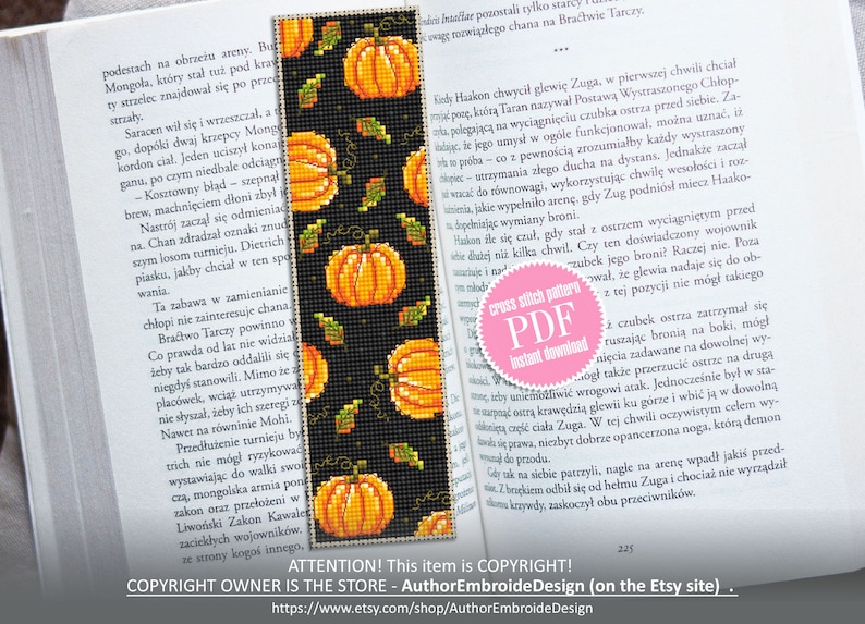 May include: A cross stitch bookmark pattern featuring a black background with orange pumpkins and green leaves. The pattern is available as a PDF instant download. The text "cross stitch pattern PDF Instant Download" is on a pink circle.