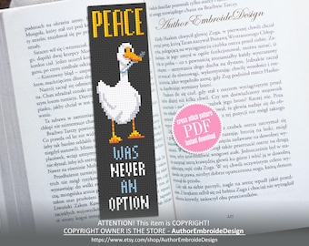 May include: A black bookmark with the text "PEACE WAS NEVER AN OPTION" and a pixelated white goose. The bookmark is placed in an open book with Polish text. A pink PDF download sticker is visible.