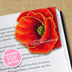 May include: A red poppy flower with a yellow center and black seeds. The flower is a cross stitch pattern and is available as a PDF instant download. The text "item is COPYRIGHT!" is visible in the image. The text "THE STORE - AuthorEmbroideDesign" is also visible in the image.