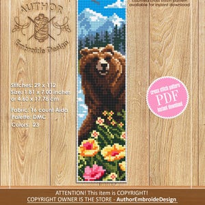 May include: A cross-stitch pattern featuring a brown bear in a mountain landscape with colorful flowers. The design measures 1.81 x 7.00 inches. The text includes "counted cross stitch pattern" and "PDF instant download".