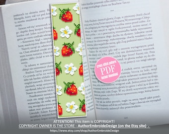 May include: A cross stitch pattern bookmark featuring a repeating pattern of red strawberries and white flowers on a green background. The bookmark is printed on a white paper with text that reads "Cross Stitch Pattern PDF Instant Download".