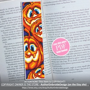 May include: A cross stitch pattern PDF for a bookmark featuring three orange pumpkins with black stems and smiling faces. The pumpkins are against a dark blue background. The text "cross stitch pattern PDF instant download" is on a pink circle.