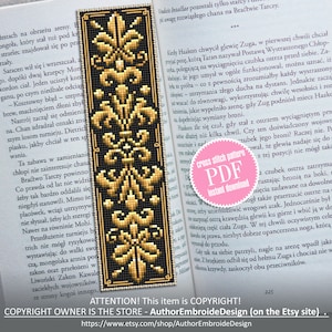 May include: A cross stitch pattern for a bookmark featuring a gold and black design with a floral motif. The pattern is available as a PDF instant download. The text "cross stitch pattern PDF instant download" is on a pink circle.