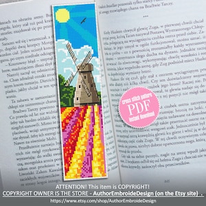 May include: Cross-stitch bookmark featuring a windmill scene with a blue sky, sun, and colorful tulip field. The bookmark is displayed on an open book. Includes the text "cross stitch pattern PDF instant download".
