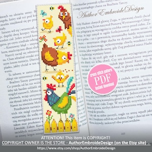 May include: A colorful cross stitch bookmark featuring a rooster, hens, and chicks. The bookmark is on a book with Polish text. The bookmark is for sale as a PDF download. The text on the bookmark reads "Author Embroide Design".