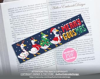 May include: A cross-stitch bookmark with a navy blue background featuring four geese in festive attire. The bookmark reads "MERRY GOOSMAS" in red, green, and yellow. The bookmark is resting on the pages of a book.