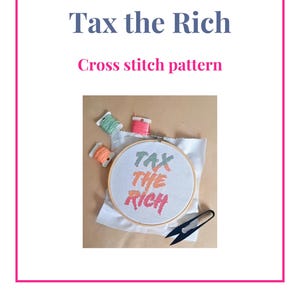May include: A cross stitch pattern with the text "Tax the Rich" in orange and pink. The image includes a wooden embroidery hoop with the stitched design, colorful thread spools, and a pair of black scissors. The design is from Thistleflat Crafts.