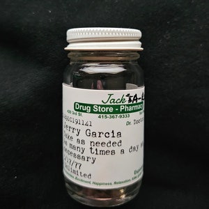 Grateful Dead - Jerry Garcia 2oz Round Glass Scrip Stash Jar 1.5"x3.5", JGB, SYF
