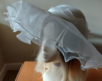 Vintage organza wedding hat suitable for decoration.  The 18cm brim consists of 3 layers of organza  which is supported by millinery wire.