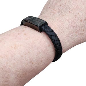 leather and metal bracelet, also a USB charging cable
