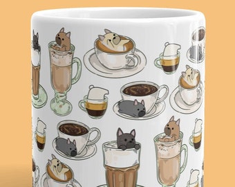 May include: White ceramic mug with a pattern of dogs in coffee cups. The mug is 11 oz and has a white background with brown, black, and beige accents. The text "THIS IS" is printed above the mug.