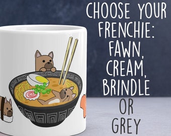 May include: White ceramic mug featuring a cartoon illustration of a French Bulldog relaxing in a bowl of ramen. The mug has the text "CHOOSE YOUR FRENCHIE: FAWN, CREAM, BRINDLE OR GREY". The "Bark & Run" logo is at the bottom.