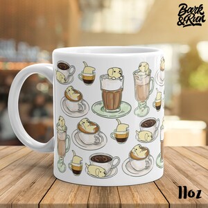 May include: White ceramic coffee mug with a pattern of yellow dogs in coffee cups. The mug has a black handle and the text "Bark & Run" is printed on the top right corner. The mug is 11 oz.
