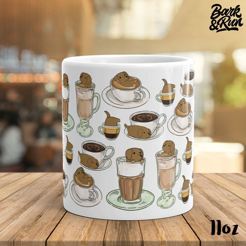 May include: White ceramic mug with a repeating pattern of brown dogs in coffee cups and glasses. The text "Bark & Run" is printed on the mug.