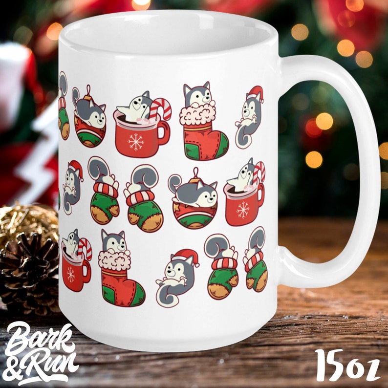 May include: White ceramic mug with a Christmas-themed design featuring a repeating pattern of cartoon huskies in various holiday poses, including wearing Santa hats, holding candy canes, and sitting in Christmas stockings. The mug has a large handle and is 15oz.