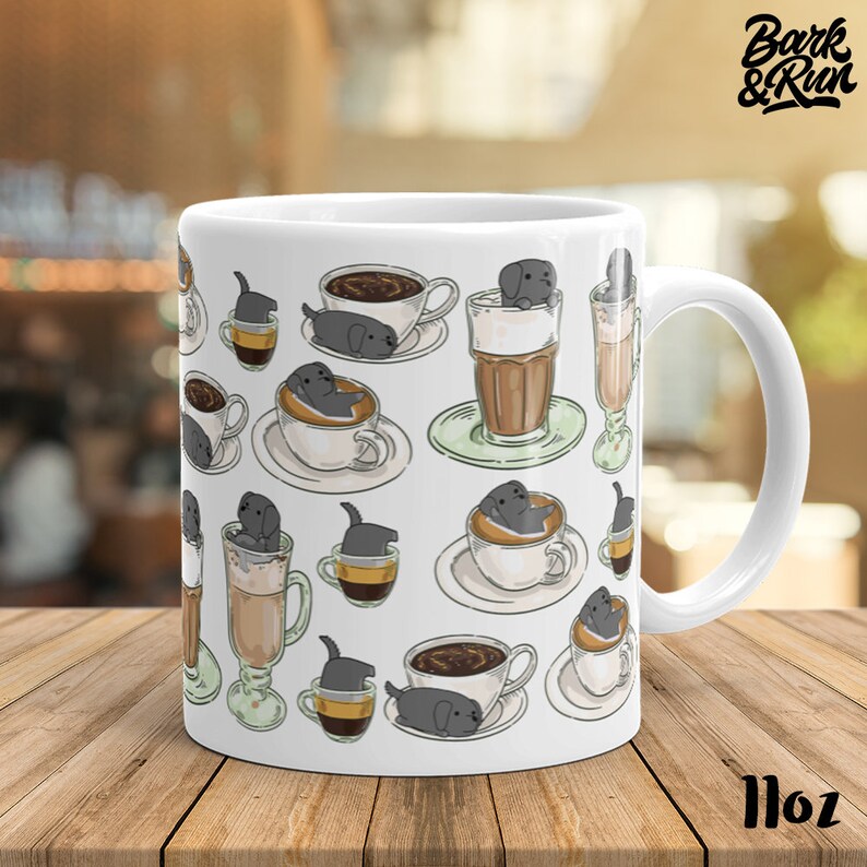 May include: White ceramic mug with a black and white illustration of dogs in coffee cups. The mug has a handle and says "Bark & Run" on the side. The mug is 11 oz.