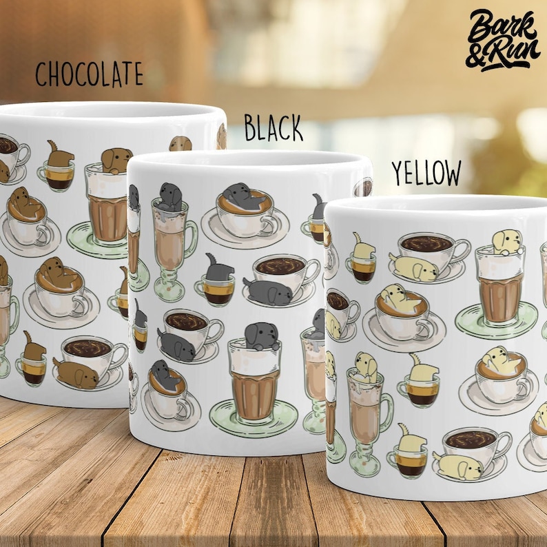 May include: Three white ceramic mugs with a pattern of dogs in coffee cups. The mugs are labeled "Chocolate", "Black", and "Yellow" and feature a repeating pattern of dogs in various colors.