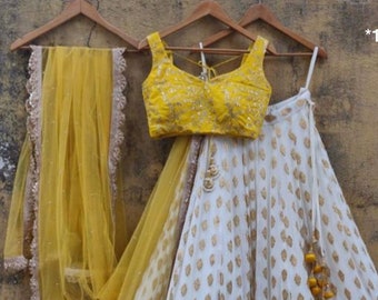 white and gold bridal lehenga