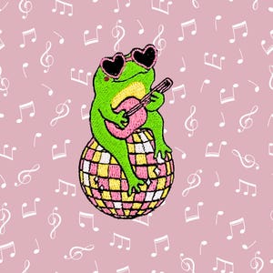 May include: A green frog wearing pink heart-shaped sunglasses sits on a pink and yellow disco ball, playing a pink guitar. The background is a pink pattern of musical notes.