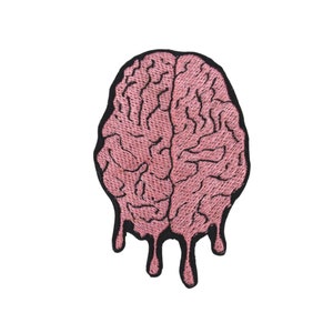 May include: A pink embroidered patch of a dripping brain. The brain is outlined in black thread.