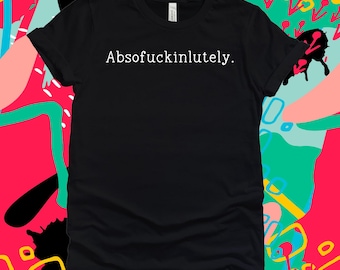 May include: Black t-shirt with the word "Absofuckinlutely." printed in white. The shirt is a crew neck style. The background is a colorful abstract design with pink, green, and blue shapes.