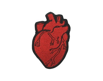 May include: Red embroidered heart patch with black outline.