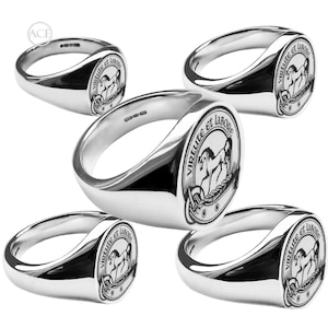 May include: Five polished silver signet rings. Each ring displays a detailed crest with a horse and the motto "Virtute et Labore" in a circular design. The rings are reflective and have a classic design.