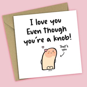 May include: A white card with the text "I love you Even though you're a knob!" features a cartoon character with a heart and the words "That's you." The card is on a brown envelope, set against a pink background.