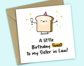 May include: A greeting card with a cartoon toast character wearing a party hat and holding a champagne glass. The card reads "A little Birthday Toast to my Sister in Law!" on a white background with a brown envelope.