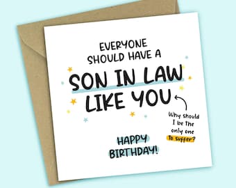 May include: A white greeting card with the text "EVERYONE SHOULD HAVE A SON IN LAW LIKE YOU" in black and blue. The card also says "HAPPY BIRTHDAY!" and "Why should I be the only one to suffer?" The card is inside a brown envelope.