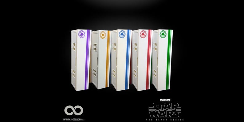 May include: Five white storage boxes with colored stripes and symbols, including purple, gold, blue, red, and green. Each box has a Star Wars logo and the text "Scaled for Star Wars The Black Series".