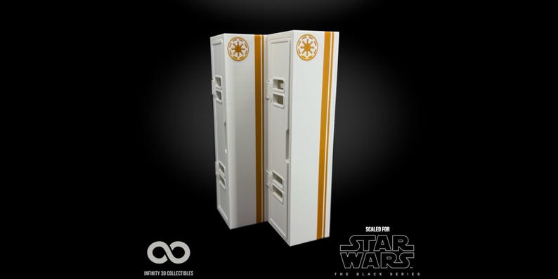 May include: Two white and gold Star Wars themed lockers. Each locker has a gold stripe down the side and a gold emblem on the top. The text "SCALED FOR STAR WARS THE BLACK SERIES" is visible.